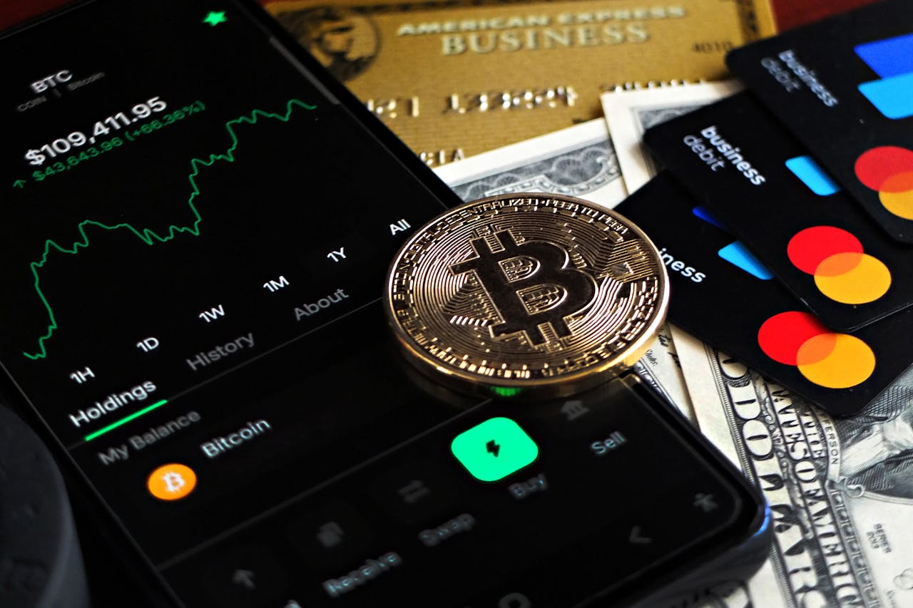 The Art of Drawing Readers In: Your attractive post title goes here Bitcoin coin with financial data, credit cards, and currency on a desk.