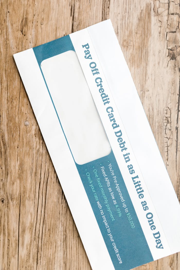 services-06 Close-up of a debt-related envelope on a wooden background, emphasizing financial concepts.